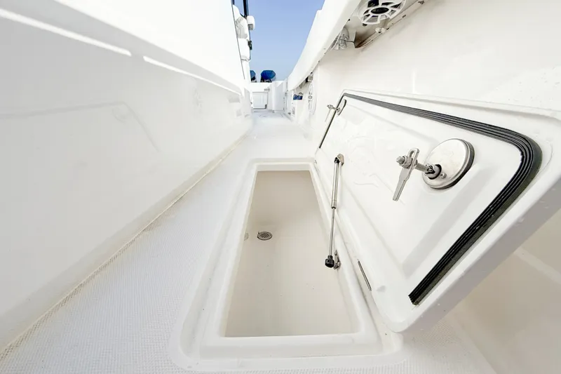  Yacht Photos Pics 2026 Blackwater 41 Sportfish boat storage compartment with open hatch and sleek design.