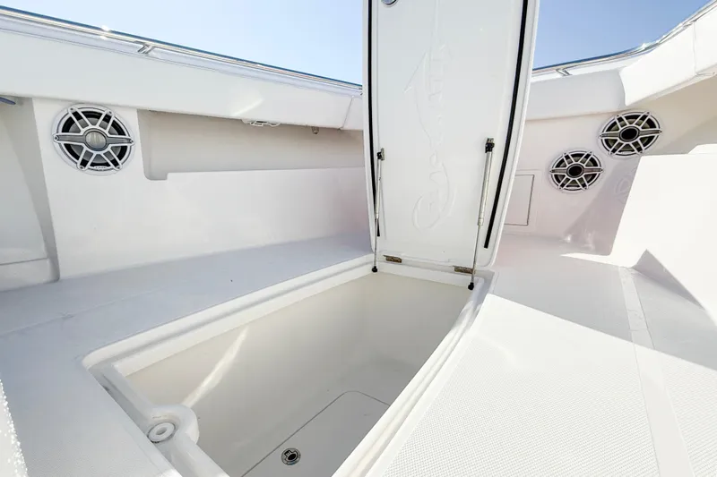  Yacht Photos Pics Open storage compartment on 2026 Blackwater 41 Sportfish boat deck with speakers.