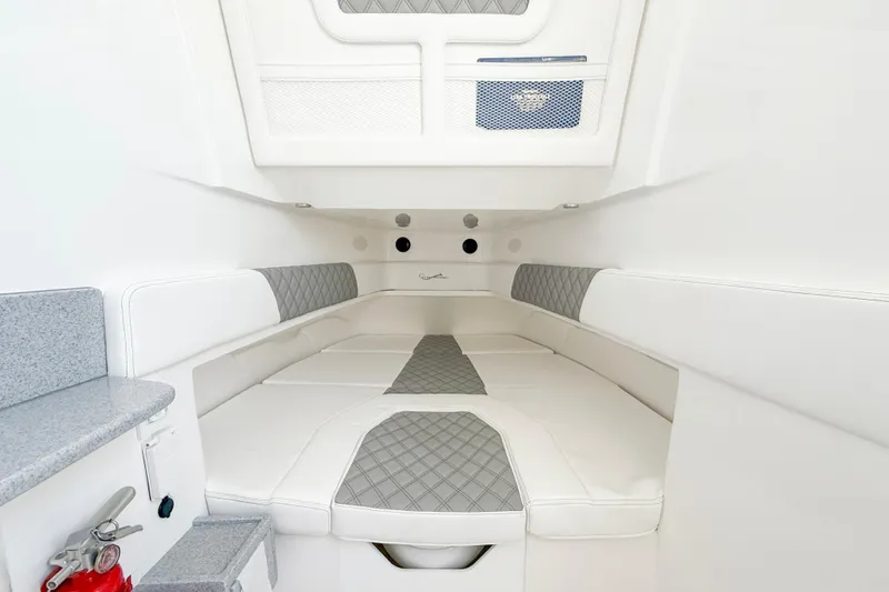  Yacht Photos Pics Luxurious interior of 2026 Blackwater 41 Sportfish boat with white and gray seating.
