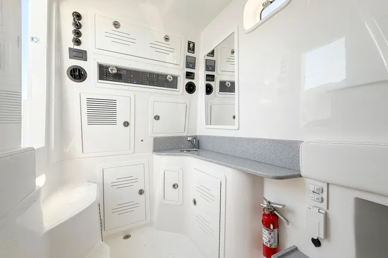  Yacht Photos Pics Interior of 2026 Blackwater 41 Sportfish boat featuring control panels and storage compartments.