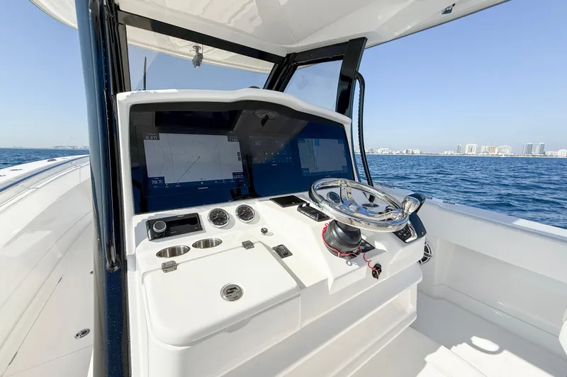  Yacht Photos Pics 2026 Blackwater 41 Sportfish helm with advanced navigation screens on open water.