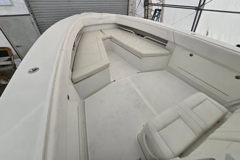  Yacht Photos Pics 2010 Jupiter 34 FS boat interior with white seating and storage compartments.