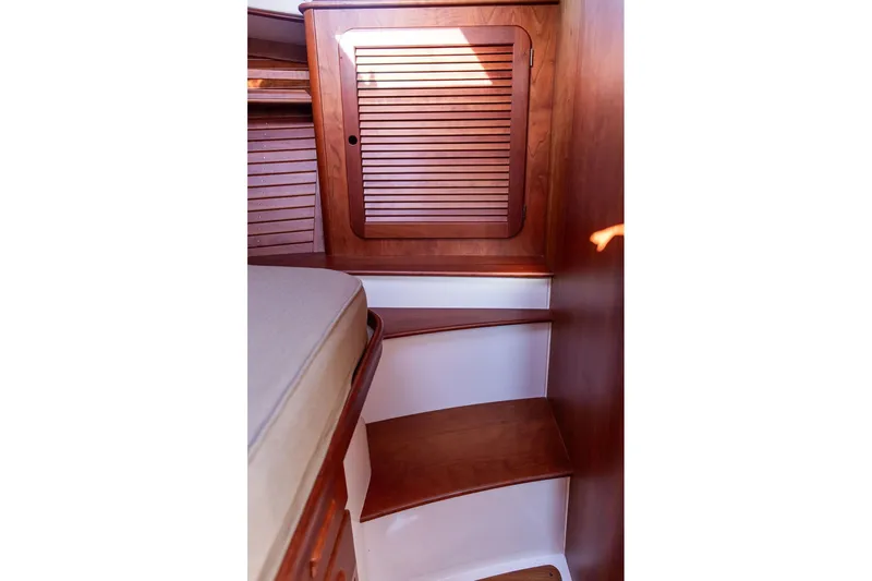 Pisces Yacht Photos Pics Interior of 2017 Hinckley Picnic Boat MKIII with wooden cabinetry and steps.