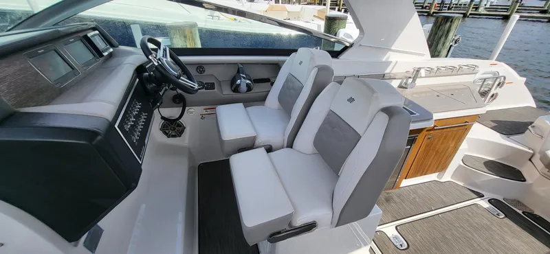  Yacht Photos Pics 2018 Four Winns H350 OB boat interior with dual helm seats and modern dashboard.
