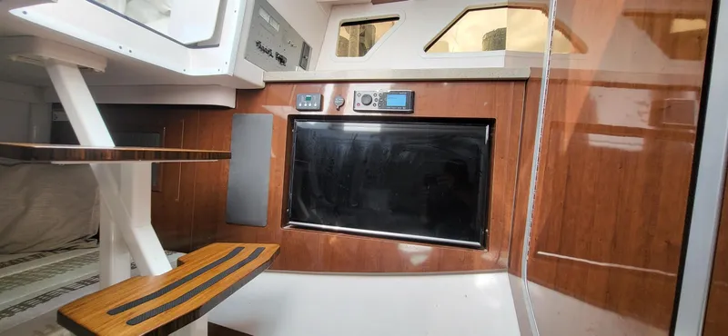  Yacht Photos Pics 2018 Four Winns H350 OB cabin interior with wood paneling and modern amenities.