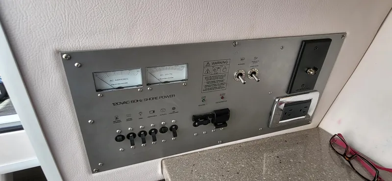  Yacht Photos Pics Control panel of a 2018 Four Winns H350 OB boat, featuring switches and gauges.