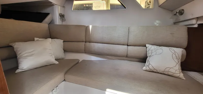  Yacht Photos Pics Interior of 2018 Four Winns H350 OB boat with beige seating and cushions.