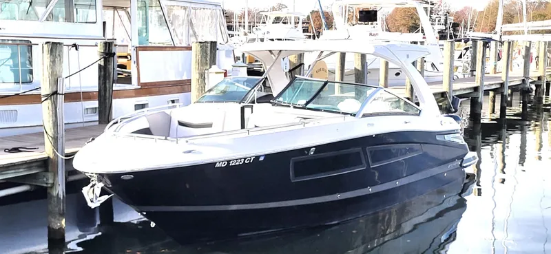  Yacht Photos Pics 2018 Four Winns H350 OB boat docked at a marina, featuring sleek design and spacious deck.