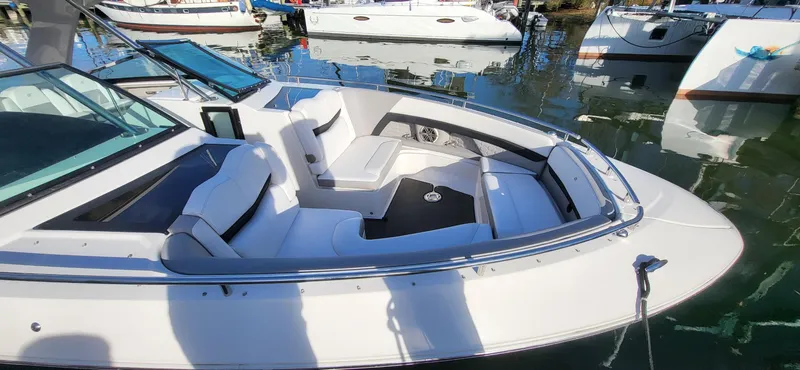  Yacht Photos Pics 2018 Four Winns H350 OB boat with white seating, docked in a marina.