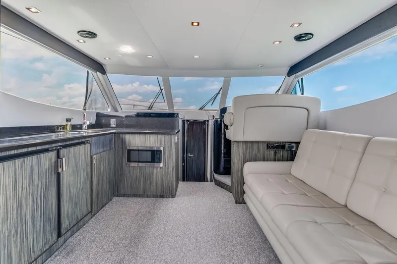  Yacht Photos Pics Interior of 2019 Silverton 41 Sport Bridge yacht with modern kitchen and seating area.