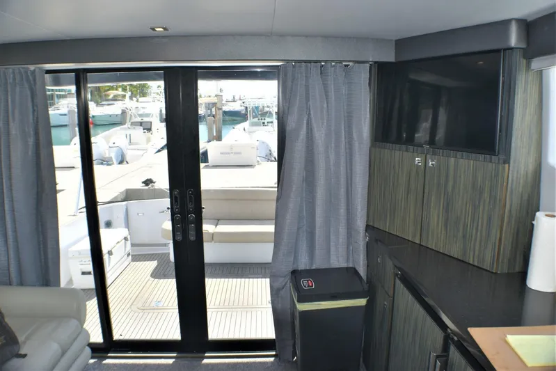  Yacht Photos Pics Interior view of 2019 Silverton 41 Sport Bridge yacht with sliding glass doors.