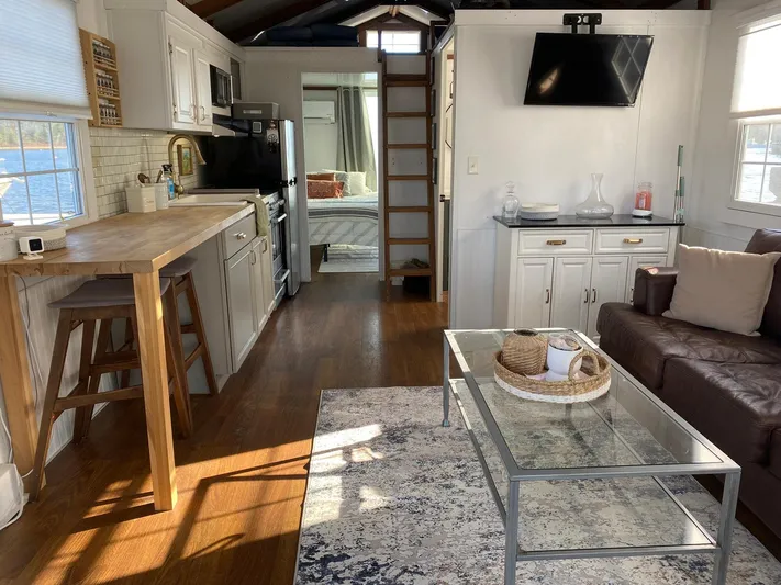  Yacht Photos Pics Modern interior of 2018 Catamaran Cruisers 42 Aqualodge with kitchen, living area, and bedroom.