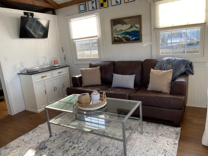  Yacht Photos Pics Cozy living area in 2018 Catamaran Cruisers 42 Aqualodge with sofa, TV, and decor.