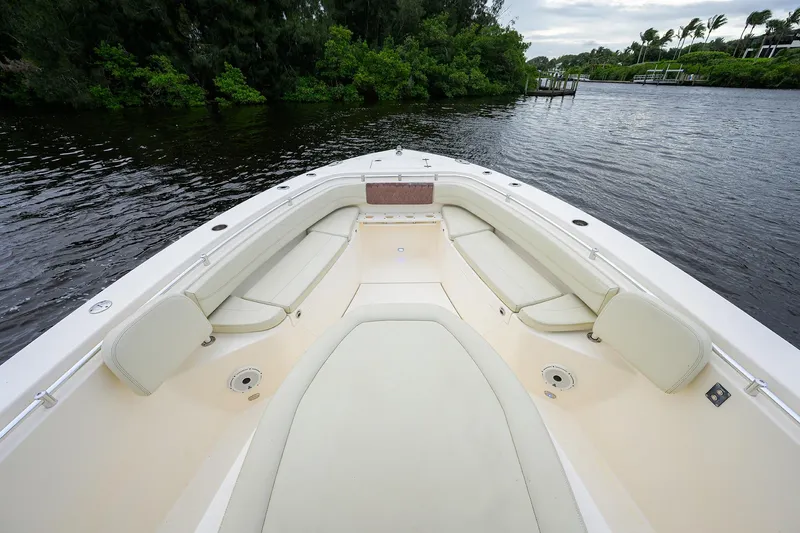 Conched Out Yacht Photos Pics 2020 Cobia 350 CC boat interior with spacious seating on a calm river.
