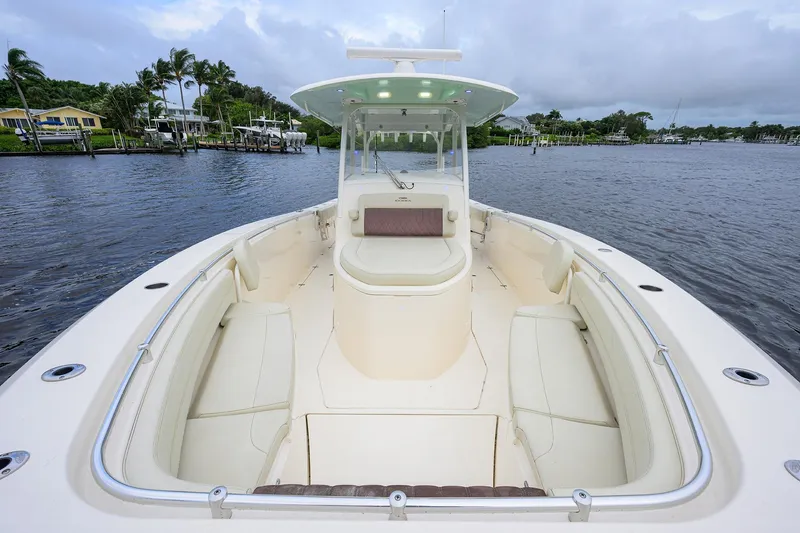 Conched Out Yacht Photos Pics 2020 Cobia 350 CC boat with spacious seating on calm waters.