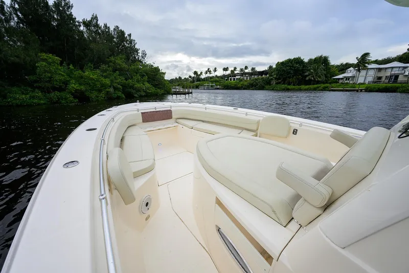 Conched Out Yacht Photos Pics 2020 Cobia 350 CC boat interior with seating, on a calm river.