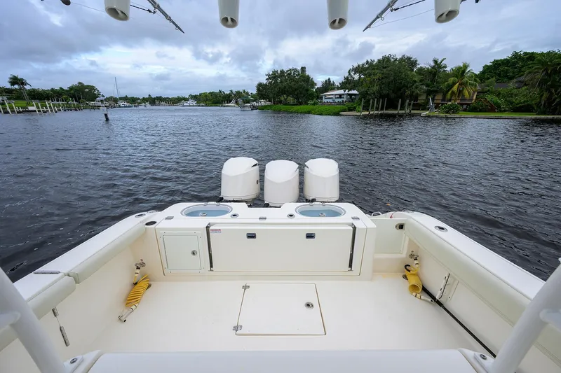 Conched Out Yacht Photos Pics 2020 Cobia 350 CC boat with triple engines on a scenic waterway.