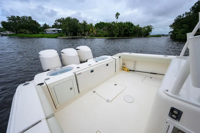 Conched Out Yacht Photos Pics 2020 Cobia 350 CC boat with triple engines on a calm river.