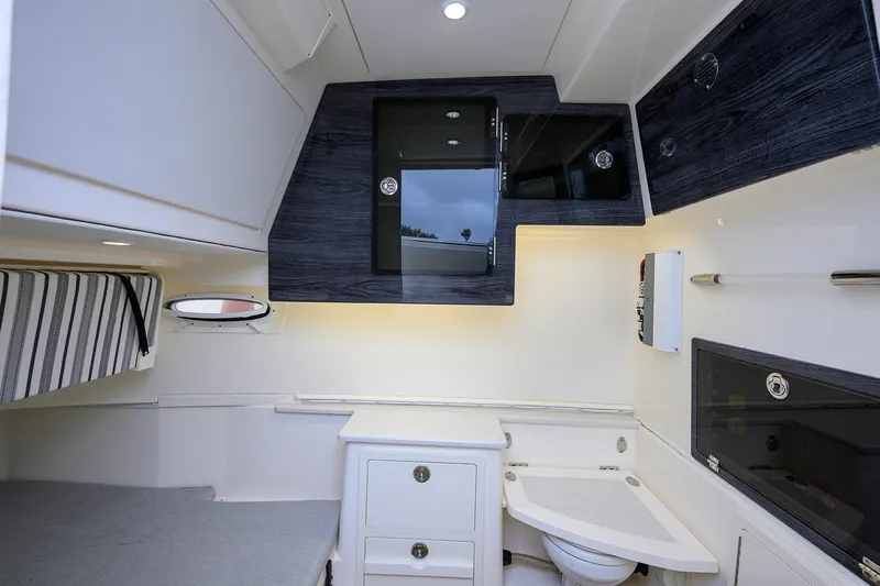 Conched Out Yacht Photos Pics 2020 Cobia 350 CC cabin interior with modern amenities and sleek design.