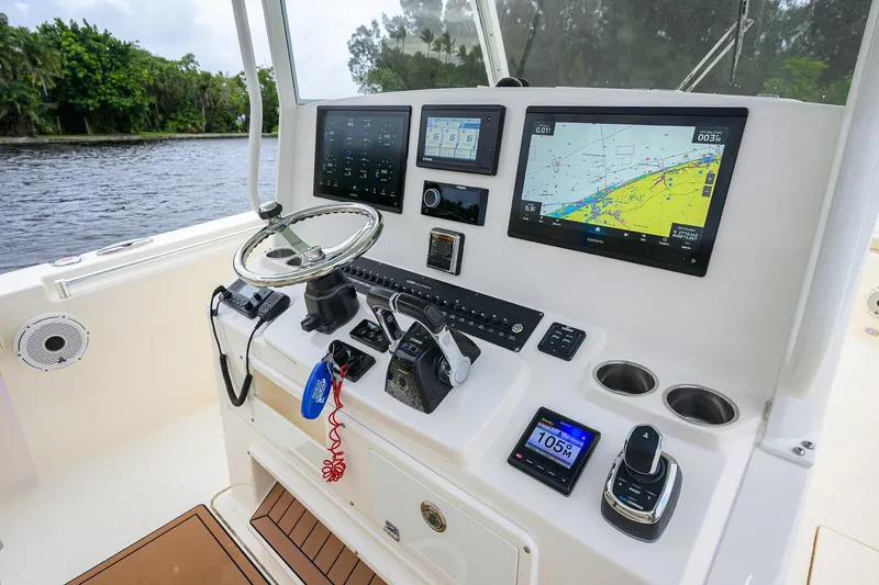 Conched Out Yacht Photos Pics 2020 Cobia 350 CC boat dashboard with navigation screens and controls.