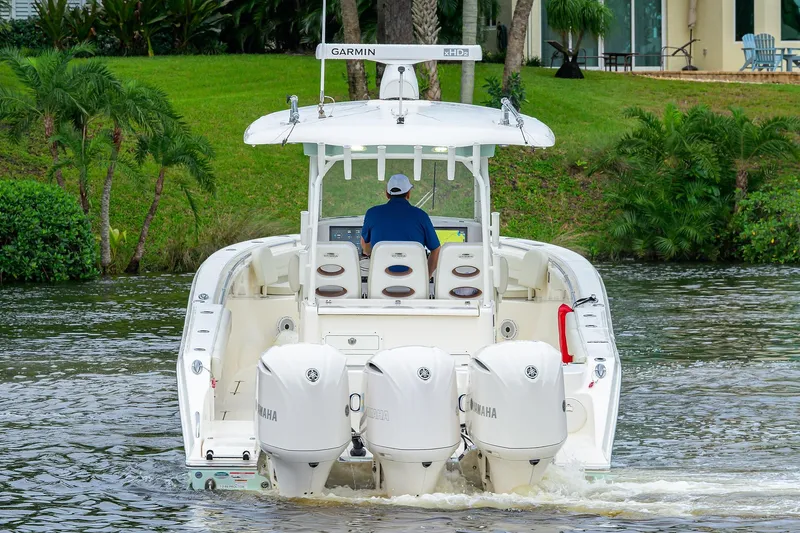 Conched Out Yacht Photos Pics 2020 Cobia 350 CC boat with triple Yamaha engines on a scenic waterway.