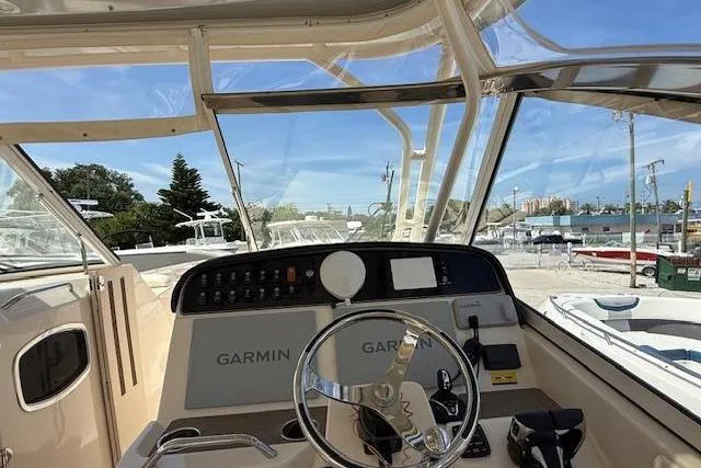 35-514 Brokerage Tyler Yacht Photos Pics 2023 Grady-White Freedom 335 boat dashboard with Garmin navigation system.
