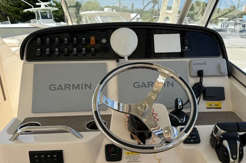 35-514 Brokerage Tyler Yacht Photos Pics 2023 Grady-White Freedom 335 boat dashboard with Garmin navigation system.