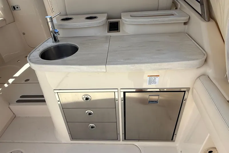 35-514 Brokerage Tyler Yacht Photos Pics 2023 Grady-White Freedom 335 boat interior with sink, storage drawers, and countertop.