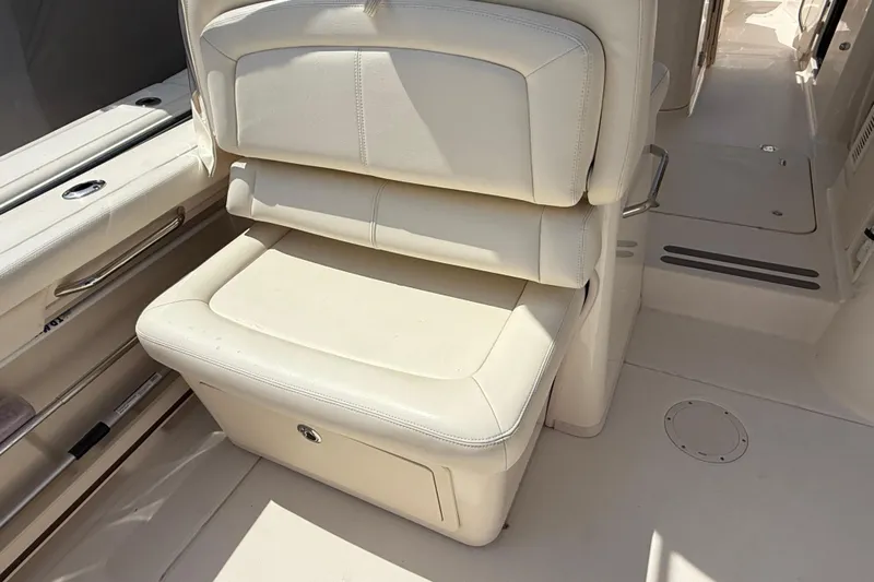 35-514 Brokerage Tyler Yacht Photos Pics 2023 Grady-White Freedom 335 boat interior with cream leather seating.