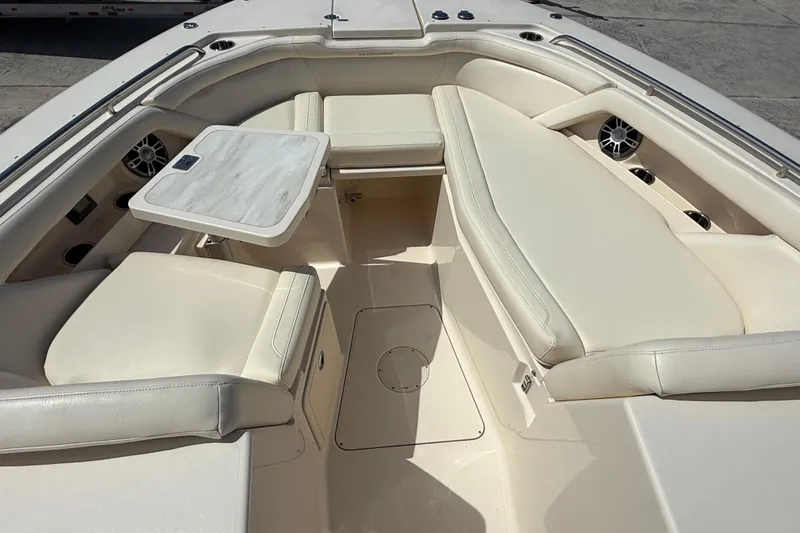 35-514 Brokerage Tyler Yacht Photos Pics 2023 Grady-White Freedom 335 boat interior with cushioned seating and table.