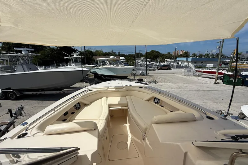 35-514 Brokerage Tyler Yacht Photos Pics 2023 Grady-White Freedom 335 boat interior with seating, docked in a marina.