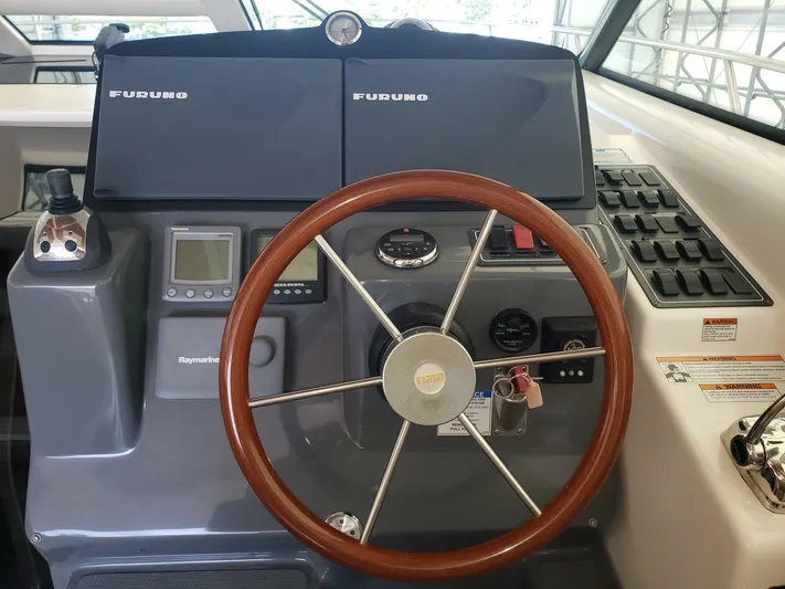 Supernova Yacht Photos Pics 2007 Tiara Yachts 4300 Sovran helm with Furuno navigation and Raymarine displays.