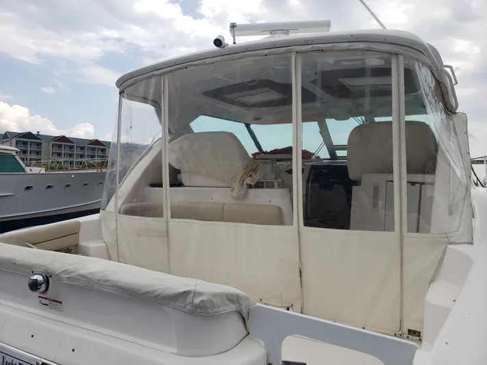 Supernova Yacht Photos Pics 2007 Tiara Yachts 4300 Sovran with enclosed cockpit, docked at marina.