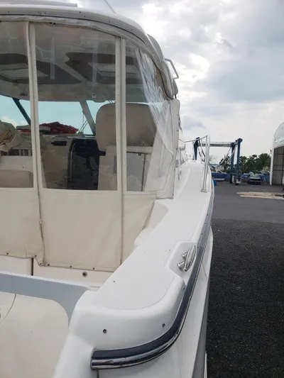 Supernova Yacht Photos Pics 2007 Tiara Yachts 4300 Sovran docked, featuring a sleek white exterior and covered cockpit.