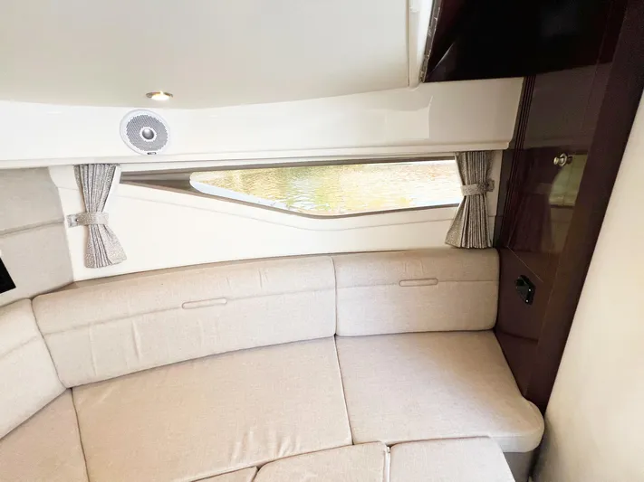 Grateful! Yacht Photos Pics Interior of 2019 Sea Ray Sundancer 320 Outboard with beige seating and window view.