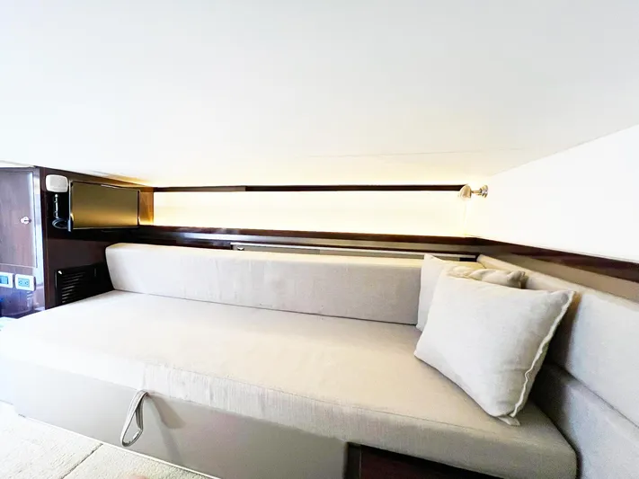 Grateful! Yacht Photos Pics 2019 Sea Ray Sundancer 320 Outboard interior with a comfortable beige sofa and modern lighting.
