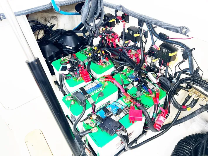 Grateful! Yacht Photos Pics Battery compartment of a 2019 Sea Ray Sundancer 320 Outboard, showcasing wiring and connections.