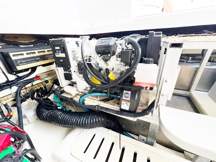 Grateful! Yacht Photos Pics Engine compartment of 2019 Sea Ray Sundancer 320 Outboard with visible components and wiring.