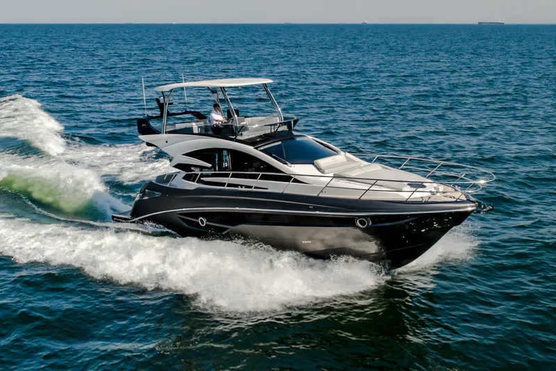 Custom Order Your 52 Fly Today! Yacht Photos Pics Luxury Cobrey 52 FLY yacht cruising on open sea, 2026 model.