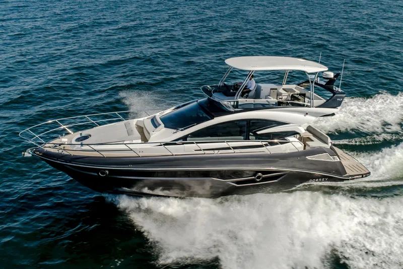 Custom Order Your 52 Fly Today! Yacht Photos Pics 2026 Cobrey 52 FLY yacht cruising on open water, showcasing sleek design and luxury features.