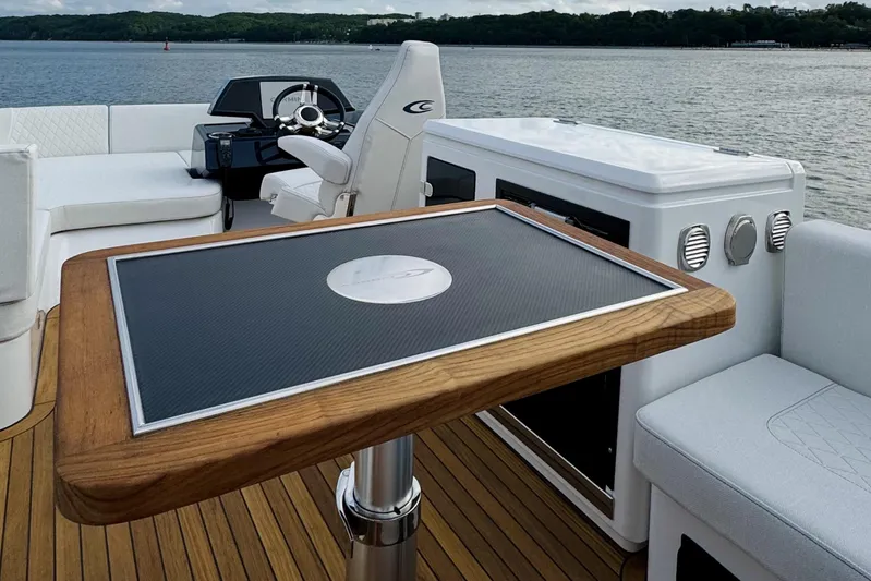 Custom Order Your 52 Fly Today! Yacht Photos Pics Luxurious 2026 Cobrey 52 FLY yacht interior with elegant seating and modern helm.