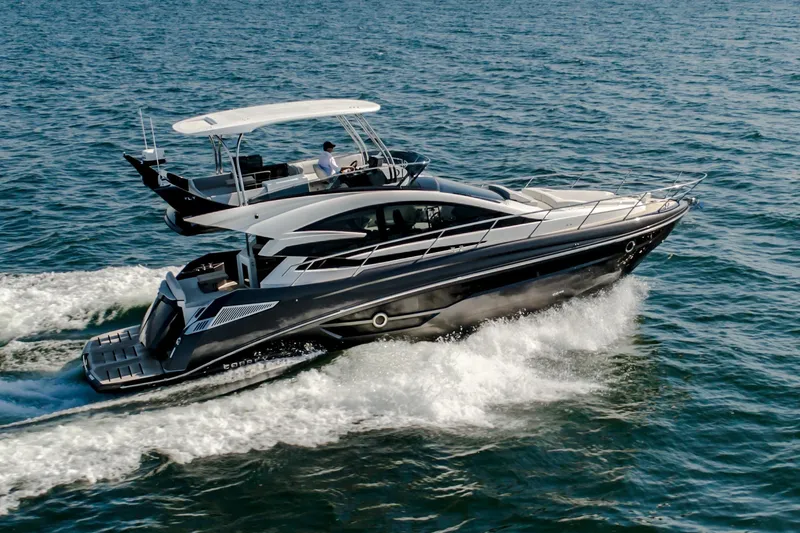 Custom Order Your 52 Fly Today! Yacht Photos Pics 2026 Cobrey 52 FLY yacht cruising on open water, showcasing sleek design and luxury.