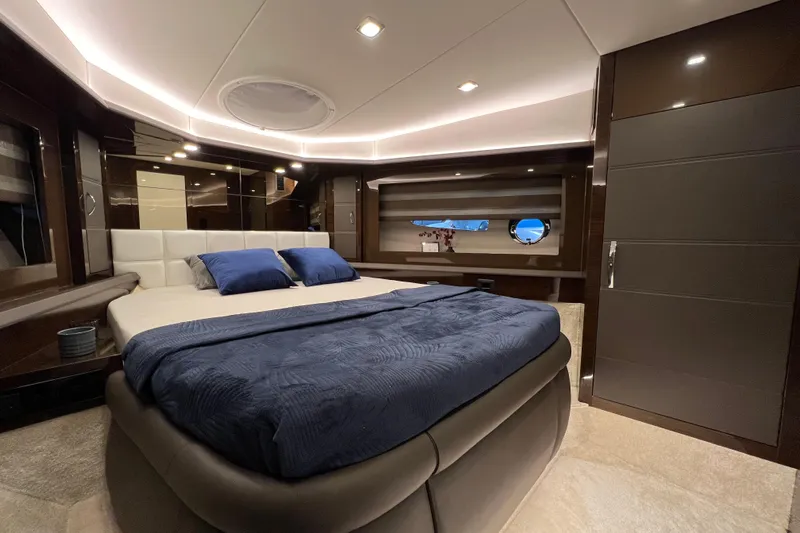 Custom Order Your 52 Fly Today! Yacht Photos Pics Luxurious bedroom interior of 2026 Cobrey 52 FLY yacht with modern design.