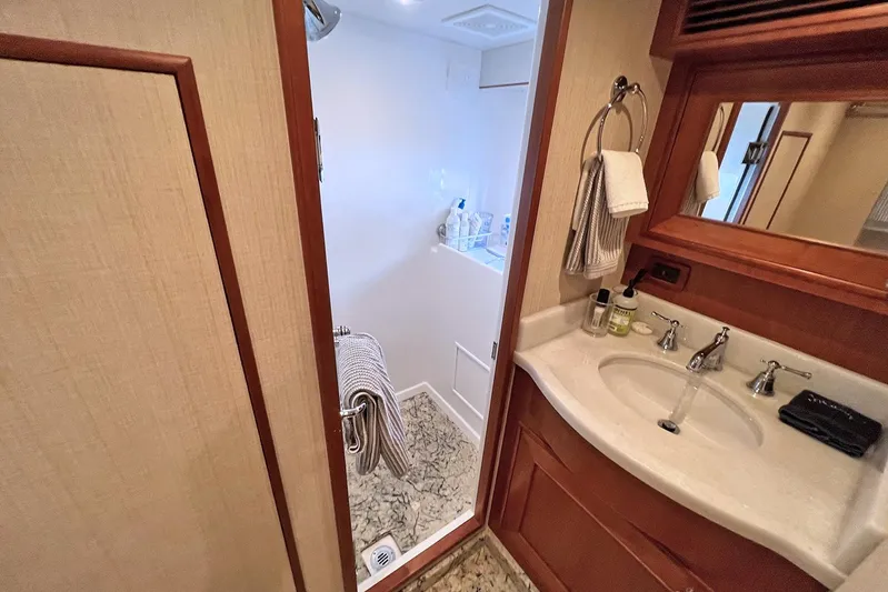 Insignia Yacht Photos Pics Luxurious bathroom in 2017 Outer Reef Yachts 860 Deluxbridge Motoryacht, featuring elegant fixtures and decor.
