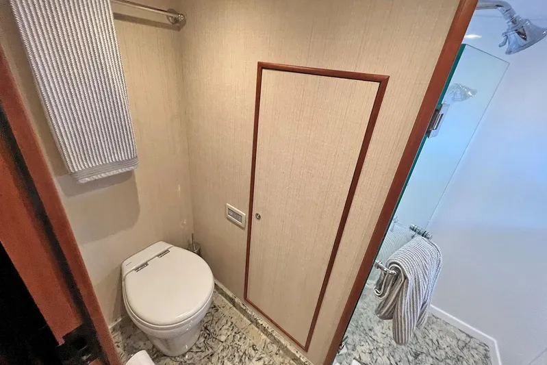 Insignia Yacht Photos Pics Bathroom interior of 2017 Outer Reef Yachts 860 Deluxbridge Motoryacht, featuring modern amenities.