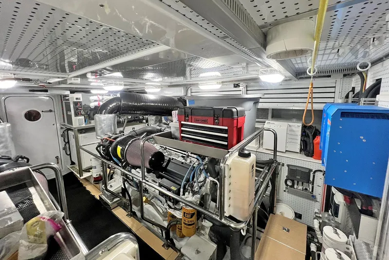 Insignia Yacht Photos Pics Engine room of 2017 Outer Reef Yachts 860 Deluxbridge Motoryacht, featuring organized equipment and tools.