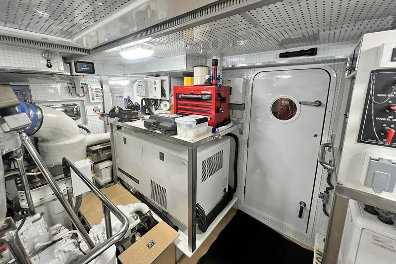 Insignia Yacht Photos Pics Engine room of 2017 Outer Reef Yachts 860 Deluxbridge Motoryacht, featuring equipment and tools.