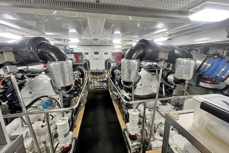 Insignia Yacht Photos Pics Engine room of 2017 Outer Reef Yachts 860 Deluxbridge Motoryacht, showcasing dual engines and equipment.