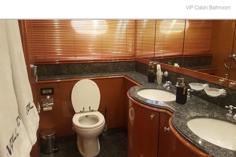 Natalia Yacht Photos Pics Luxurious VIP cabin bathroom on 2005 Sunseeker 105 Yacht with elegant fixtures and granite countertops.