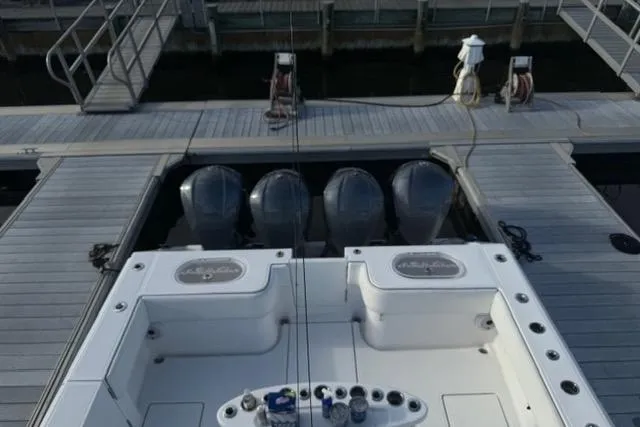  Yacht Photos Pics 2015 SeaHunter Center Console boat docked with four powerful outboard engines.
